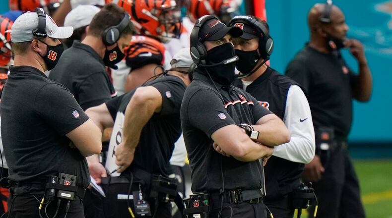 Cincinnati Bengals head coach Zac Taylor watched his team during the second half of an NFL football game against the Miami Dolphins, Sunday, Dec. 6, 2020, in Miami Gardens, Fla. (AP Photo/Lynne Sladky)
