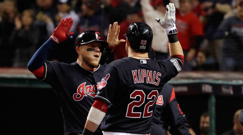 Roberto Perez #55 of the Cleveland Indians celebrates with Jason Kipnis #22 after hitting a solo home run during the fourth inning against the Chicago Cubs in Game One of the 2016 World Series at Progressive Field on October 25, 2016 in Cleveland, Ohio. (Photo by Jamie Squire/Getty Images)