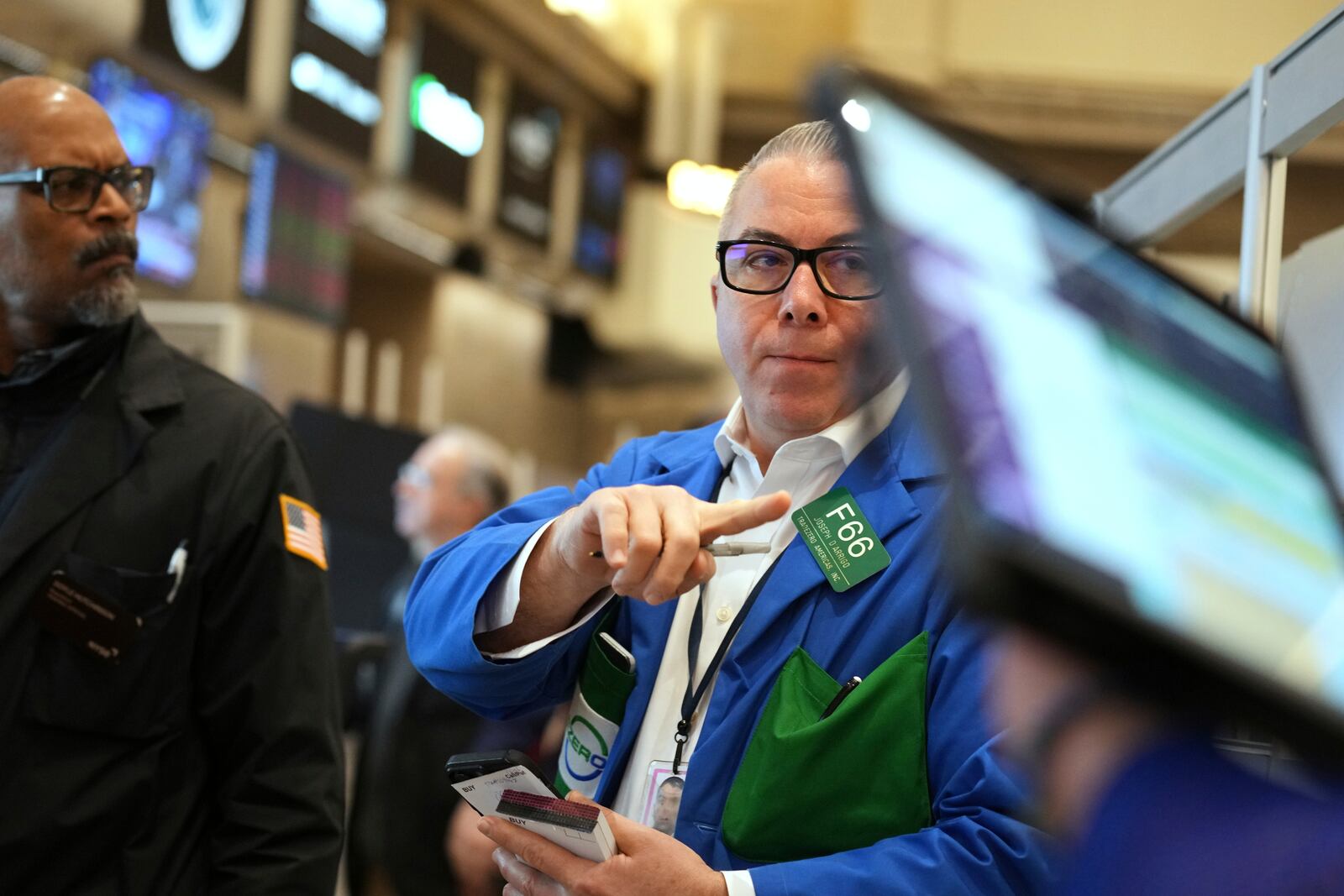 Joseph D'Arrigo works on the floor at the New York Stock Exchange in New York, Thursday, April 3, 2025. (AP Photo/Seth Wenig)