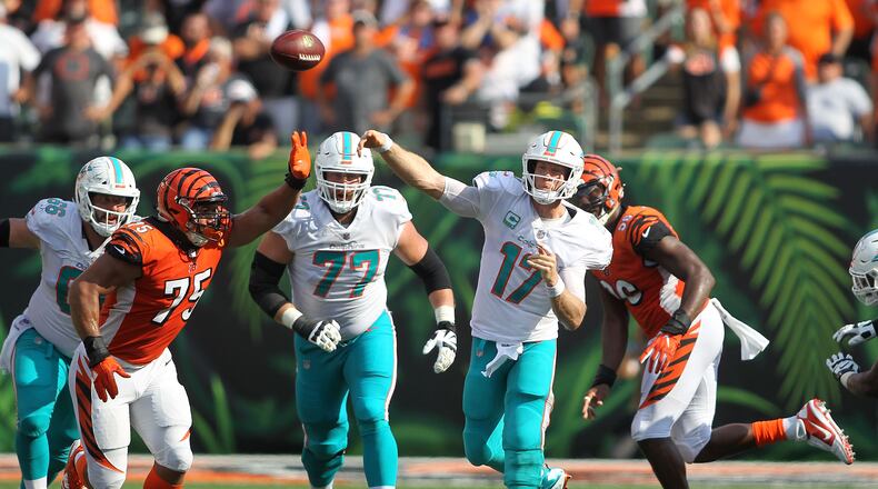 CINCINNATI, OH - OCTOBER 7: Ryan Tannehill #17 of the Miami Dolphins throws a pass over Jordan Willis #75 of the Cincinnati Bengals during the fourth quarter at Paul Brown Stadium on October 7, 2018 in Cincinnati, Ohio. Cincinnati defeated Miami 27-17. (Photo by John Grieshop/Getty Images)