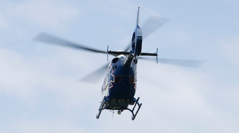 A CareFlight medical helicopter heads to an area hospital. BILL LACKEY/STAFF