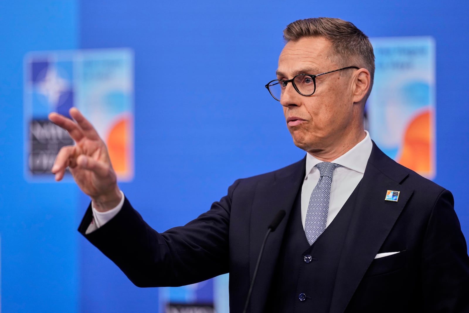 Finland's President Alexander Stubb speaks with the media as he arrives for the NATO summit in The Hague, Netherlands, Wednesday, June 25, 2025. (AP Photo/Matthias Schrader)