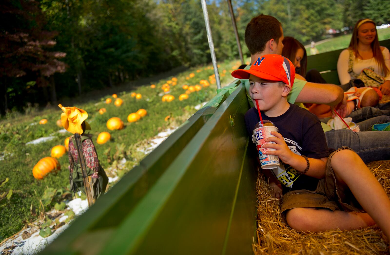 Landon Souther rides a tractor pulled hayride as he makes his way around Burt's Pumpkin Farm in Dawsonville on Sunday, October 13, 2013. Started in 1972, Burt's Pumpkin Farm grows close to 70,000 pumpkins each year on thier 272 acre farm. JONATHAN PHILLIPS / SPECIAL