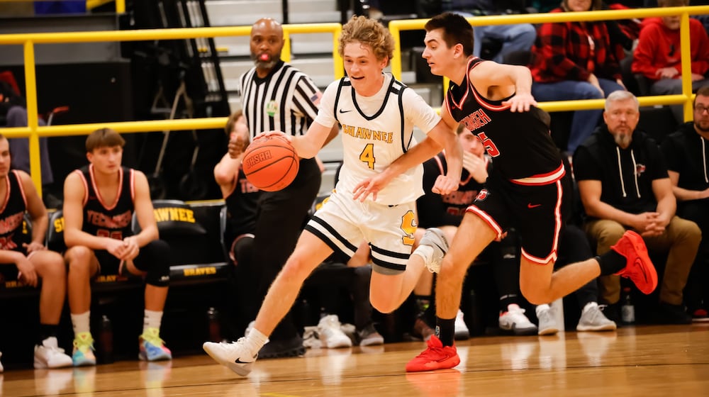 Shawnee High School junior guard Charlie Lemon drives past Tecumseh senior Brycen Dixon during their game on Tuesday night in Springfield. The Arrows won 45-41. CONTRIBUTED PHOTO