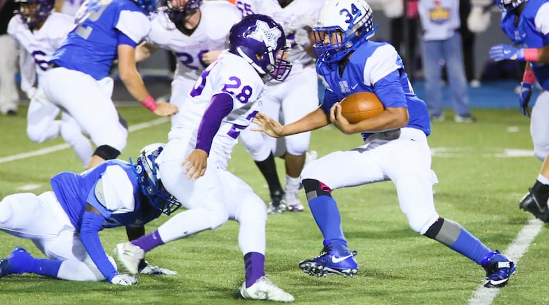 Hamilton running back Zach Reese (34) runs 78 yards for a touchdown during their game against Middletown at Virgil Schwarm Stadium in Hamilton on Oct. 21, 2016. Host Big Blue won 34-10. GREG LYNCH/STAFF