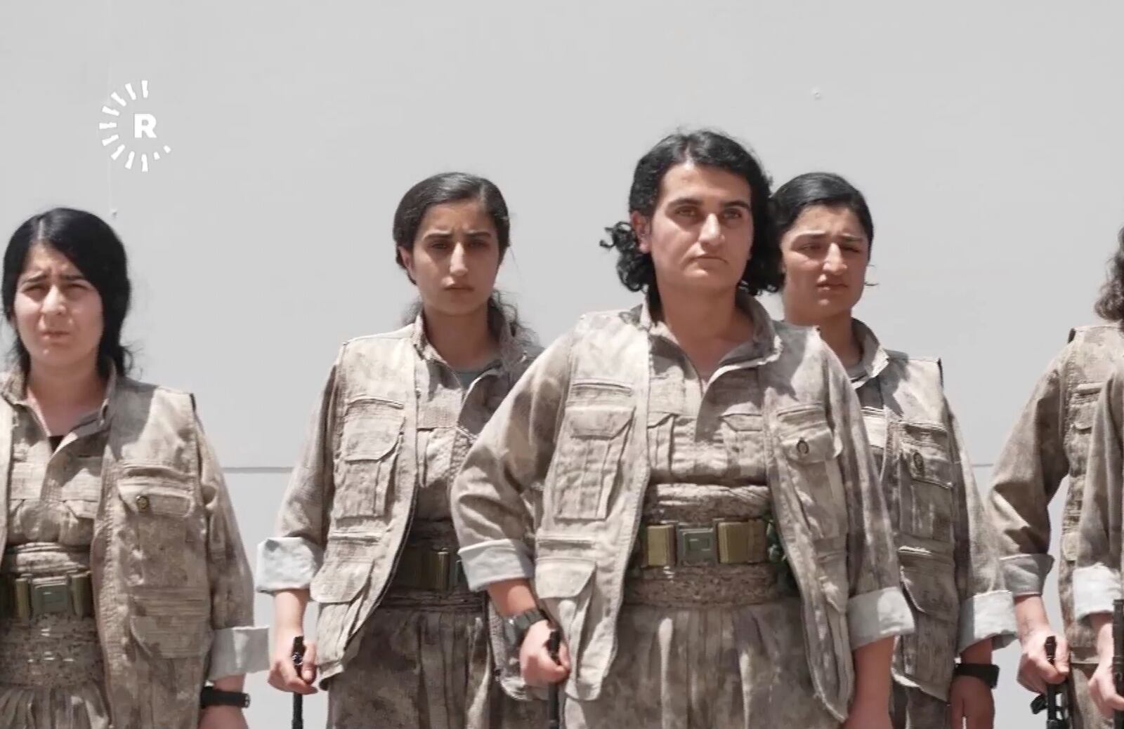This frame grab from a video released by Rudy TV shows PPK (Kurdistan Workers' Party) female fighters during a symbolic disarmament ceremony as part of the peace process with Turkey, in Sulaymaniyah governorate, part of Iraq's semi-autonomous Kurdish region, Friday, July 11, 2025. (Rudaw TV via AP)