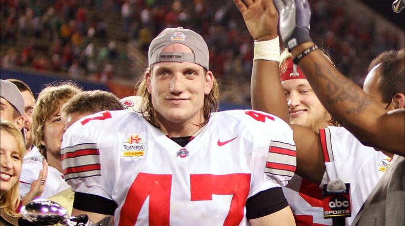 TEMPE, AZ - JANUARY 02: Linebacker A.J. Hawks #47 of the Ohio State Buckeyes holds his defensive player of the game award as his teammates cheer after the Buckeyes defeated the Notre Dame Fighting Irish in the Tostito's Fiesta Bowl at Sun Devil Stadium on January 2, 2006 in Tempe, Arizona. The Buckeyes defeated the Fighting Irish 34-20. (Photo by Jeff Gross/Getty Images)