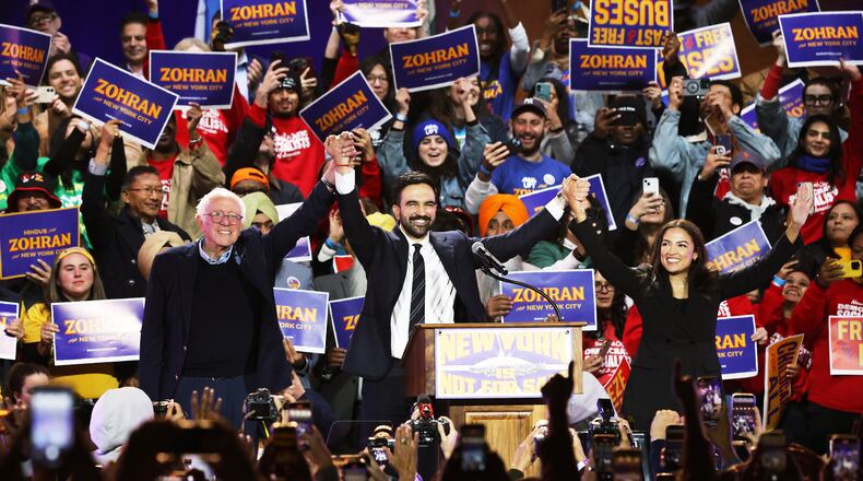 Sen. Bernie Sanders, I-Vt., left, New York City mayoral candidate Zohran Mamdani, center, and Rep. Alexandria Ocasio-Cortez, D-N.Y., appear on stage during a rally, Sunday, Oct. 26, 2025, in New York. (AP Photo/Heather Khalifa)