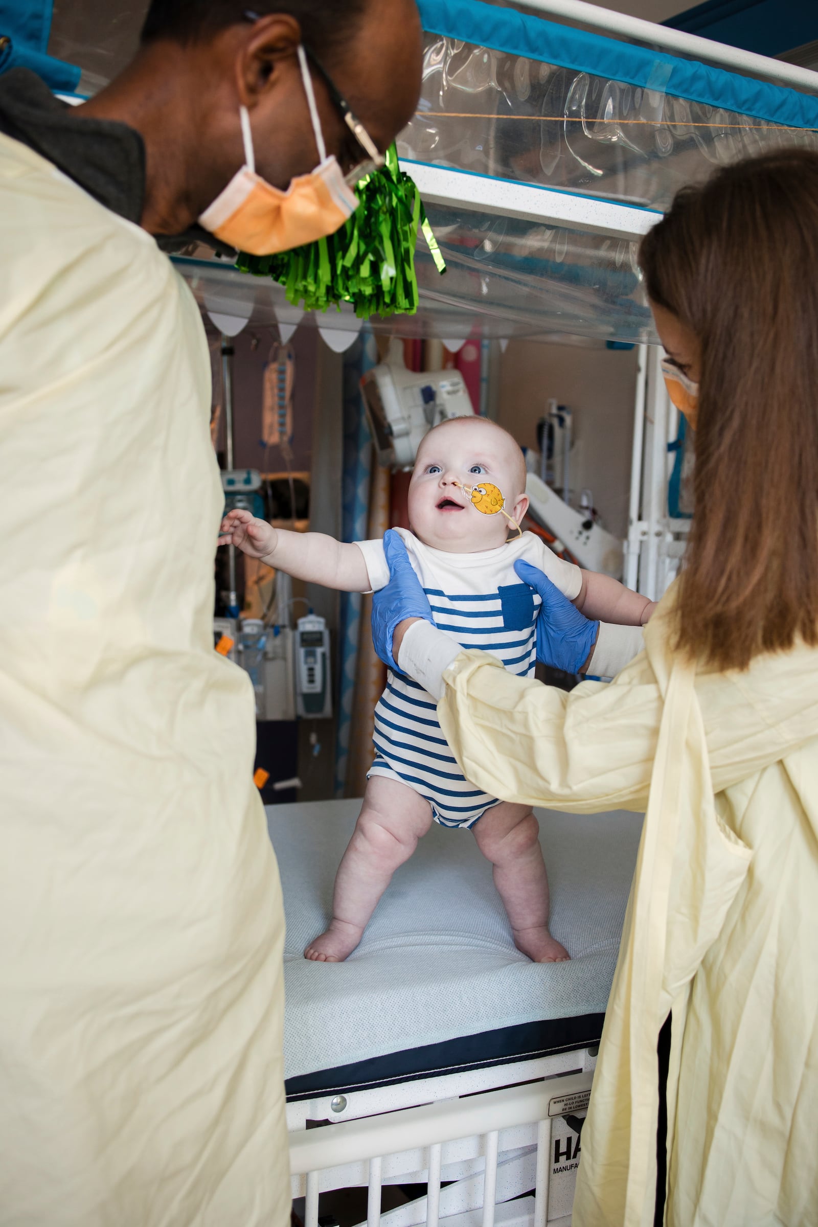 In this photo provided by the Children's Hospital of Philadelphia, Drs. Kiran Musunuru, left, and Rebecca Ahrens-Nicklas stand with KJ Muldoon, center, after a follow up dose of an experimental gene editing treatment at the hospital in April 2025. (Chloe Dawson/Children's Hospital of Philadelphia via AP)