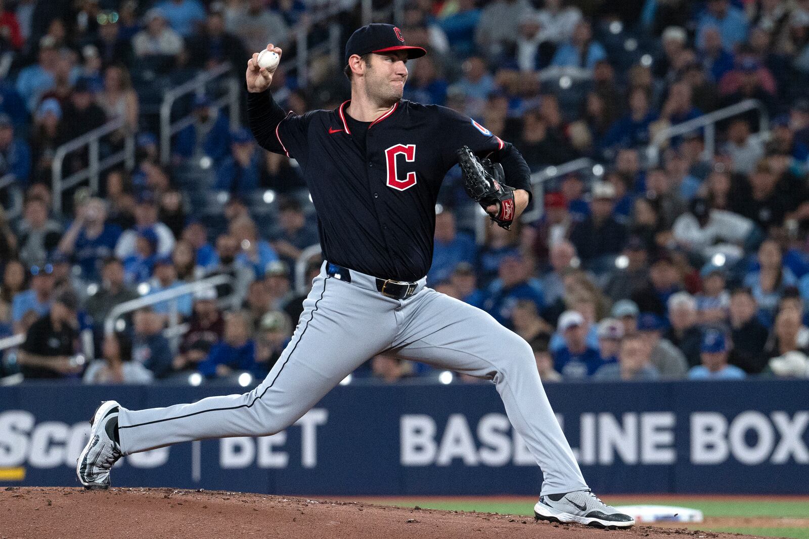 Cleveland Guardians starting pitcher Gavin Williams (32) throws to a Toronto Blue Jays batter during the first inning of a baseball game in Toronto, Saturday, May 3, 2025. (Jon Blacker/The Canadian Press via AP)