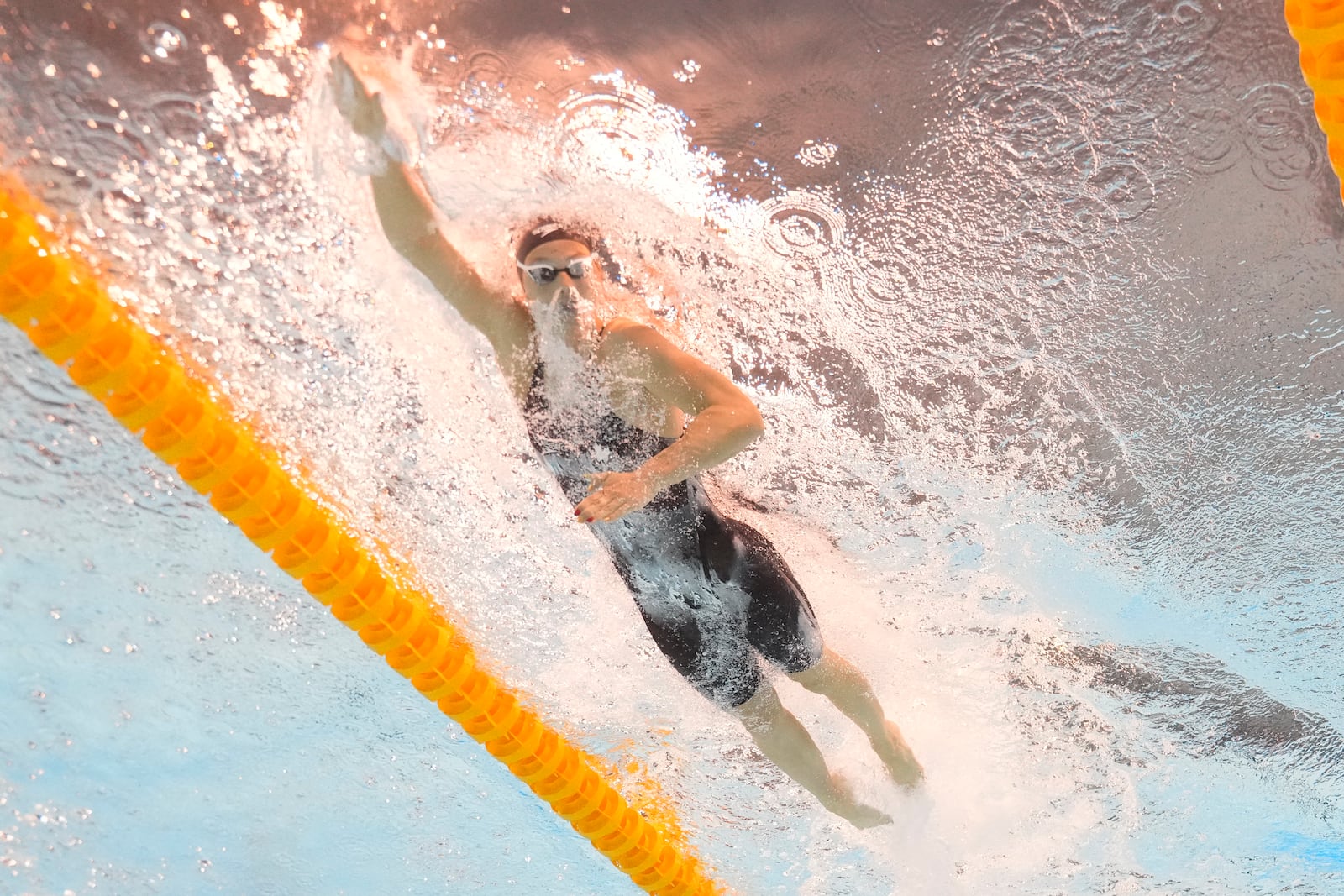 Summer Mcintosh of Canada competes in the women's 200-meter individual medley heat at the World Aquatics Championships in Singapore, Sunday, July 27, 2025. (AP Photo/Lee Jin-man)