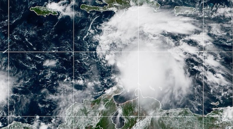 This NOAA satellite image taken at 11:40 a.m. EST on Tuesday, Oct. 21, 2025, shows Tropical Storm Melissa in the Central Caribbean Sea. (NOAA via AP)