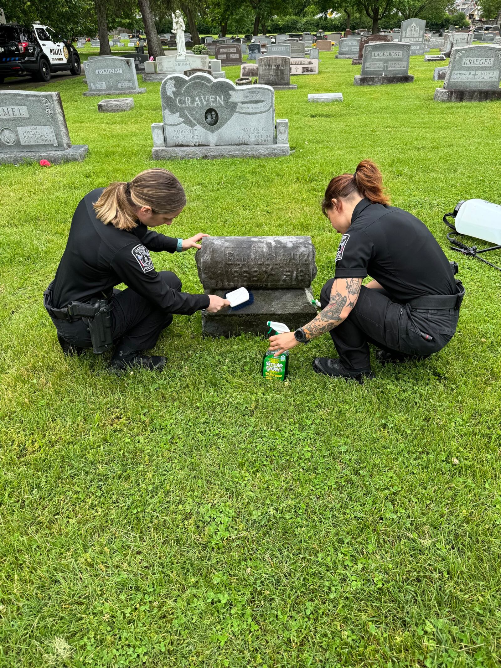 Hamilton officers cleaned the graves of fallen officers as part of National Police Week. SUBMITTED