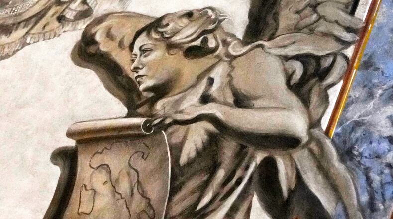 A detail of a fresco inside the Basilica of San Lorenzo in Lucina, in Rome, shows a cherub bearing a striking resemblance to Premier Giorgia Meloni, Sunday, Feb. 1, 2026. (AP Photo/Gregorio Borgia)