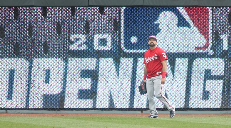Nationals left fielder Adam Eaton patrols the outfield during batting practice before a game against the Reds on Opening Day on Friday, March 30, 2018, at Great American Ball Park in Cincinnati. David Jablonski/Staff