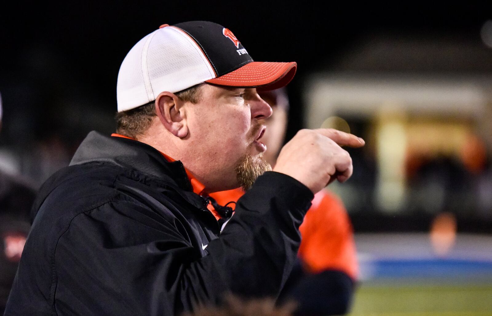 Madison coach Steve Poff speaks to his team after its 15-10 loss to Wheelersburg in a Division V state semifinal Friday night at Herrnstein Field in Chillicothe. NICK GRAHAM/STAFF