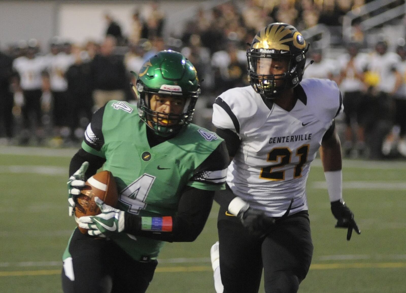 Northmont’s Devin Kenerly beats Dom Ramsey of Centerville and scored on a 19-yard run. Northmont defeated visiting and previously unbeaten Centerville 21-14 in a Week 8 GWOC crossover high school football game on Friday, Oct. 13, 2017. MARC PENDLETON / STAFF