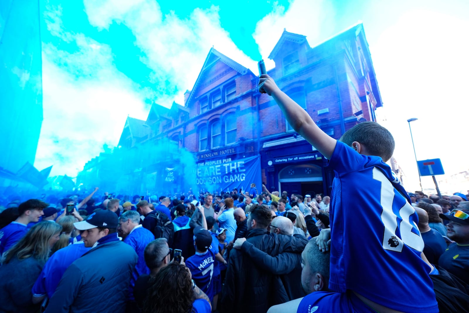 Everton fans let off flares before the English Premier League soccer match between Everton and Southampton, the last to be played at Goodison Park, Liverpool, England, Sunday, May 18, 2025. (Martin Rickett/PA via AP)