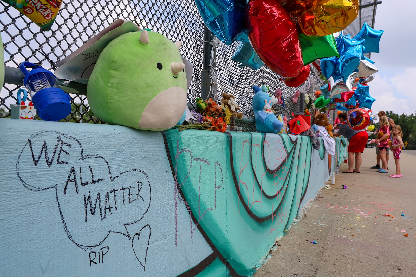 Michael Kendrick is facing charges for tampering with evidence and gross abuse of a corpse for the death of Hershall Creachbaum. A memorial has been set up on the McClure Street bridge over U.S. 35 for Creachbaum, a 7-year-old autistic boy with cerebral palsy who was found dead nearby on Saturday, July 12. BRYANT BILLING / STAFF