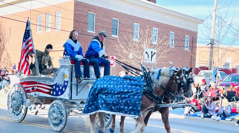 Tens of thousands of people watched the annual horse-drawn carriage parade and festival in downtown Lebanon, Ohio on Sat., Dec. 4, 2021. FILE