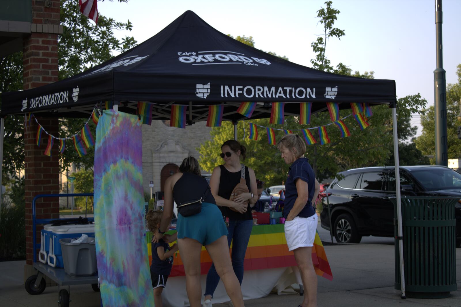 Emily Shoker tabled with Enjoy Oxford during the joint concert and pride picnic to talk about Miami University's Steel Band and the organizations involved.