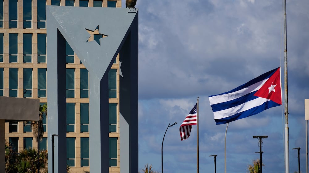 The Cuban flag flies at half-mast at the Anti-Imperialist Tribune near the U.S. embassy in Havana, Cuba, Monday, Jan. 5, 2026, in memory of Cubans who died two days before in Caracas, Venezuela during the capture of Venezuelan President Nicolas Maduro by U.S. forces. (AP Photo/Ramon Espinosa)