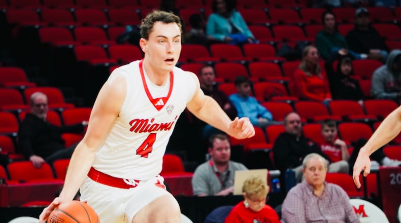 Miami's Kam Craft dribbles the ball down court against Bethany on Sunday afternoon at Millett Hall. Craft scored a career-high 34 points. Chris Vogt/CONTRIBUTED