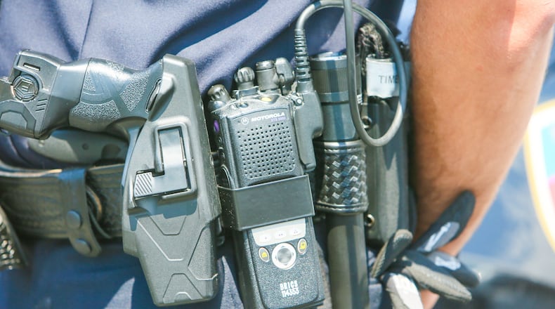 Many police and fire agencies across Butler County eschewed the county’s $10 million replacement contract with Motorola in favor of a wait and see approach. Several departments have been testing Kenwood radios as a cheaper alternative and now the fire chiefs are seeking a grant to cover the cost. ———————————————————————— Fairfield Police officer Scott Webb displays his radio outside the police station, Wednesday, Aug. 2, 2017. Butler County officials and police and fire departments across the county are looking at a $19.2 million price tag to replace parts of the 800 MHz communications systems, including the radios first responders carry.GREG LYNCH / STAFF
