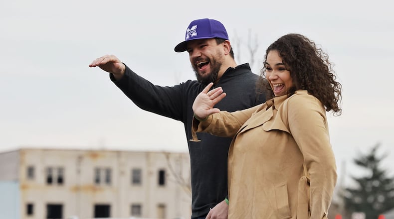 Kyle Schwarber and wife, Paige, wave at the crowd during the Middletown Santa Parade Saturday, Nov. 26, 2022 in downtown Middletown. Middletown native Kyle Schwarber served as grand marshal. NICK GRAHAM/STAFF