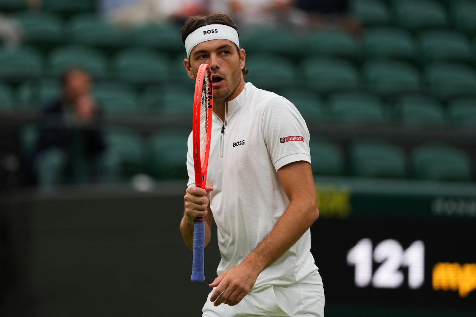 Taylor Fritz of the U.S. reacts during his men's singles fourth round match against Jordan Thompson of Australia at the Wimbledon Tennis Championships in London, Sunday, July 6, 2025.(AP Photo/Joanna Chan)