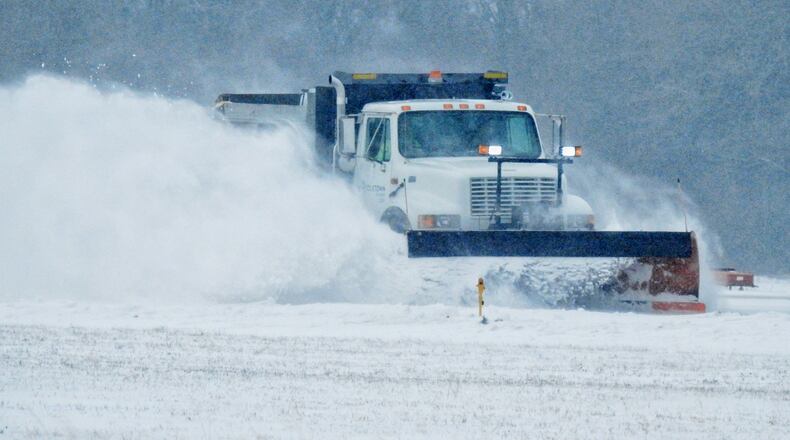 A city snow plow clears the runway at Middletown Regional Airport / Hook Field Monday, February 15, 2021 in Middletown. NICK GRAHAM / STAFF
