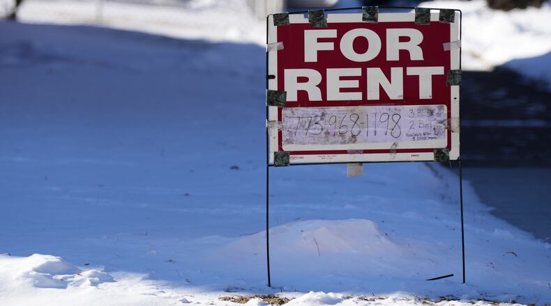 A "For Rent" sign for apartment displays outside apartment building during a cold day in Chicago, Wednesday, Jan. 28, 2026. (AP Photo/Nam Y. Huh)