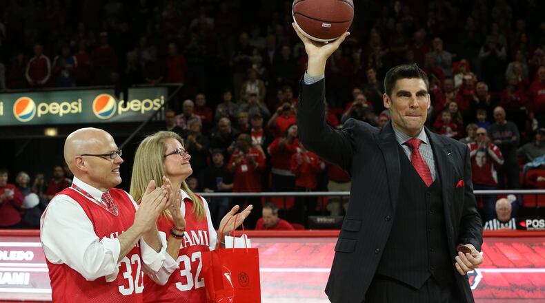 Miami University president Dr. Gregory Crawford and his wife, Dr. Renate Crawford, applaud as Wally Szczerbiak, the greatest player in school history, acknowledges the crowd at halftime of Miami’s game Friday night in Oxford. PHOTO COURTESY OF MIAMI UNIVERSITY