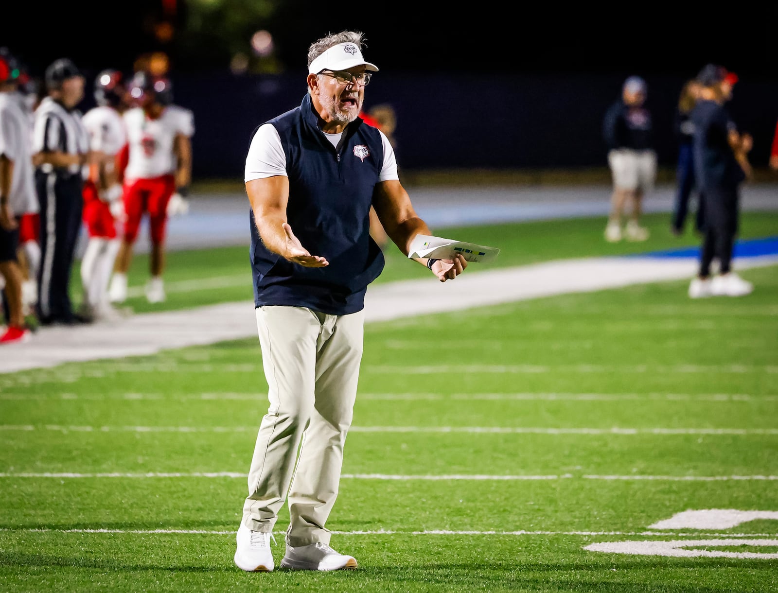 Lakota West head football coach Tom Bolden expresses his concerns to the referee during their game against Hamilton Friday, Sept. 5, 2025 at Virgil Schwarm Stadium in Hamilton. Lakota West won 38-6. NICK GRAHAM/STAFF