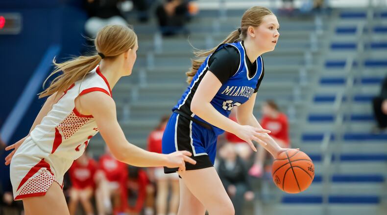 Miamisburg High School senior Madalyn Ball dribbles as a Troy defender during their Division II district semifinal game on Wednesday, Feb. 25, 2026 at Fairborn's Skyhawk Arena. The Vikings won 37-27. MICHAEL COOPER / STAFF