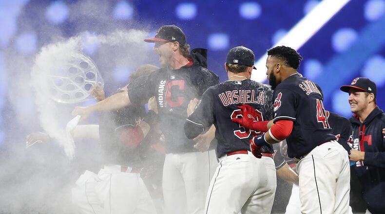 CLEVELAND, OH - SEPTEMBER 14: Cleveland Indians celebrate victory in the 10th inning over the Kansas City Royals at Progressive Field on September 14, 2017 in Cleveland, Ohio. The Indians defeated the Royals 3-2 for their 22nd win in a row, an MLB record. (Photo by Ron Schwane/Getty Images)