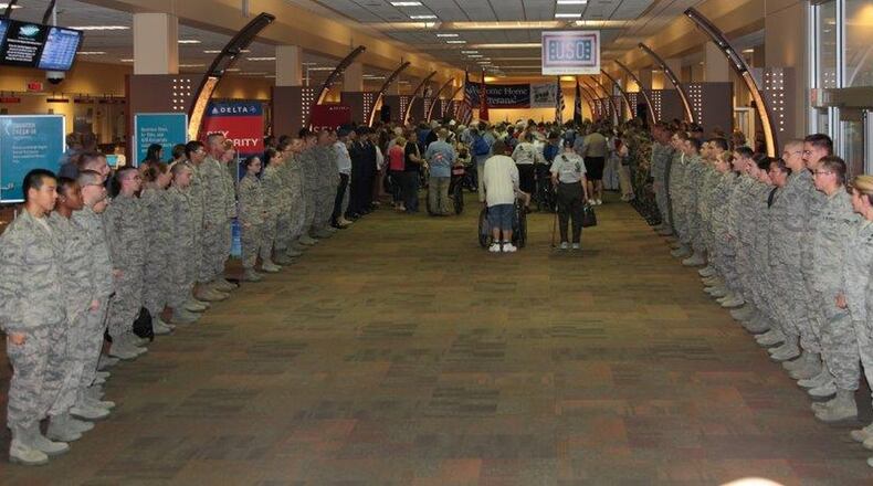 Airmen greet Honor Flight Dayton veterans returning from their final 2017 trip last November. CONTRIBUTED