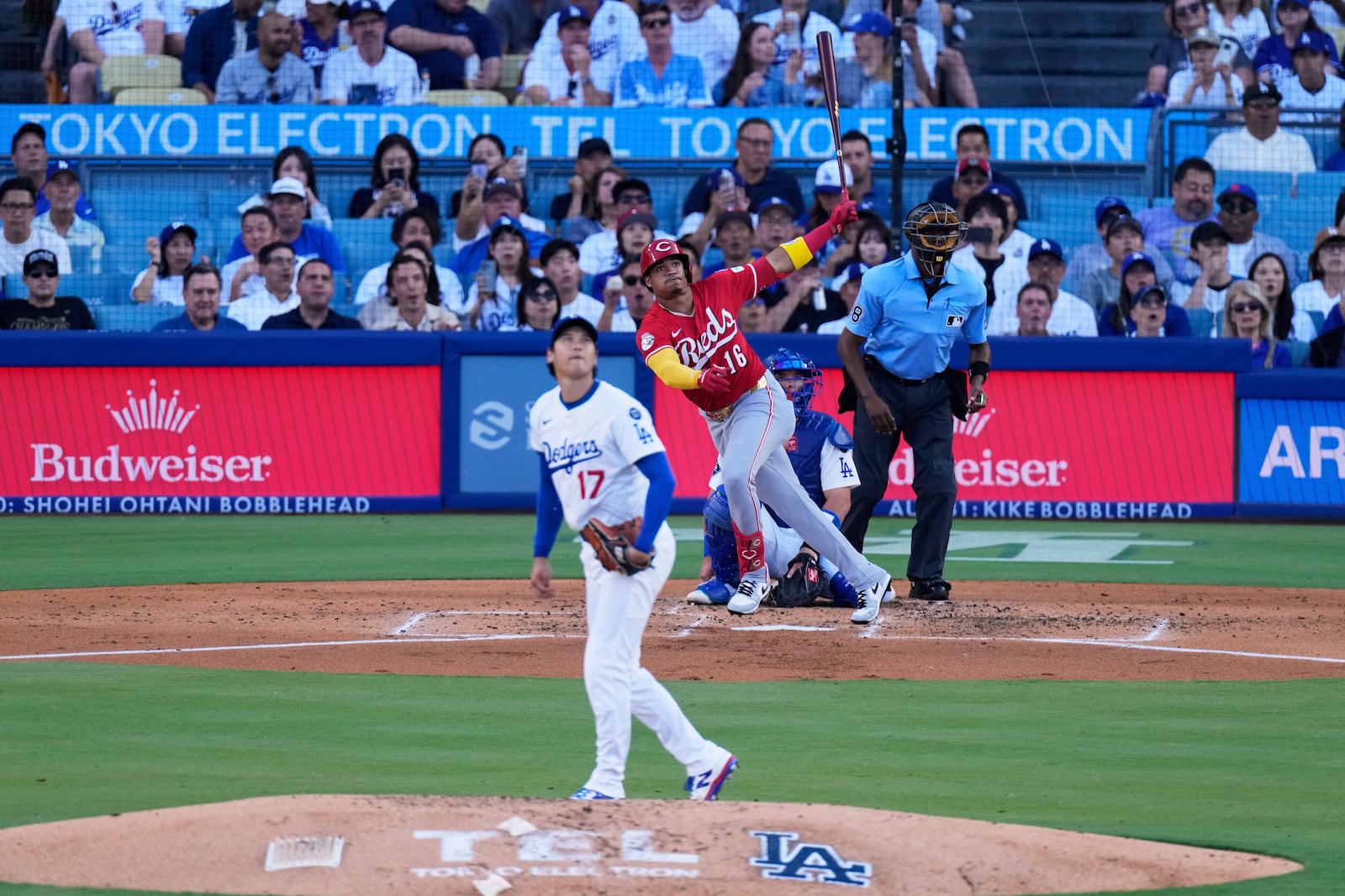 Cincinnati Reds' Noelvi Marte, right, watches his home run behind Los Angeles Dodgers starting pitcher Shohei Ohtani during the third inning of a baseball game Wednesday, Aug. 27, 2025, in Los Angeles. (AP Photo/Mark J. Terrill)