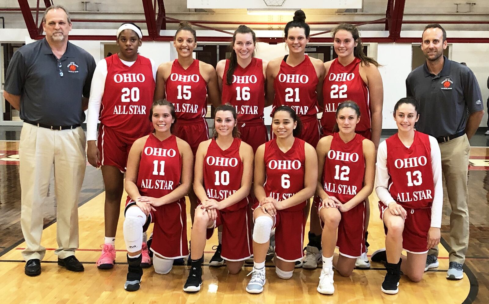 The South beat the North 131-77 on Friday night in the Ohio High School Basketball Coaches Association North-South Division I-II All-Star Game at Denison University’s Mitchell Center. The South’s team photo includes Corinne Thomas of Tecumseh (11), Kassidy Betzing of Pomeroy Meigs (10), Madison Greene of Pickerington Central (6), Jacy Sheldon of Dublin Coffman (12), Katie Shumate of Newark (13), Kennedi Myles of Walnut Hills (20), Hannah Haithcock of Washington Court House Washington (15), Rachel Cooke of Thornville Sheridan (16), Layne Ferrell of Franklin (21) and Mikala Morris of Kenton Ridge (22). The coaches are Dan Linscott of Cambridge (left) and Bryan Patton of Dublin Coffman (right). RICK CASSANO/STAFF