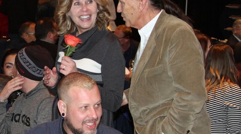 Ann Banks, who has worked at the Chamber of Commerce Serving Middletown, Monroe and Trenton for 40 years, was surprised by the recognition she received Thursday at the annual meeting at Miami Valley Gaming. She is seen with her husband, Mark, and their two sons, Steven and Matt. SUBMITTED PHOTO