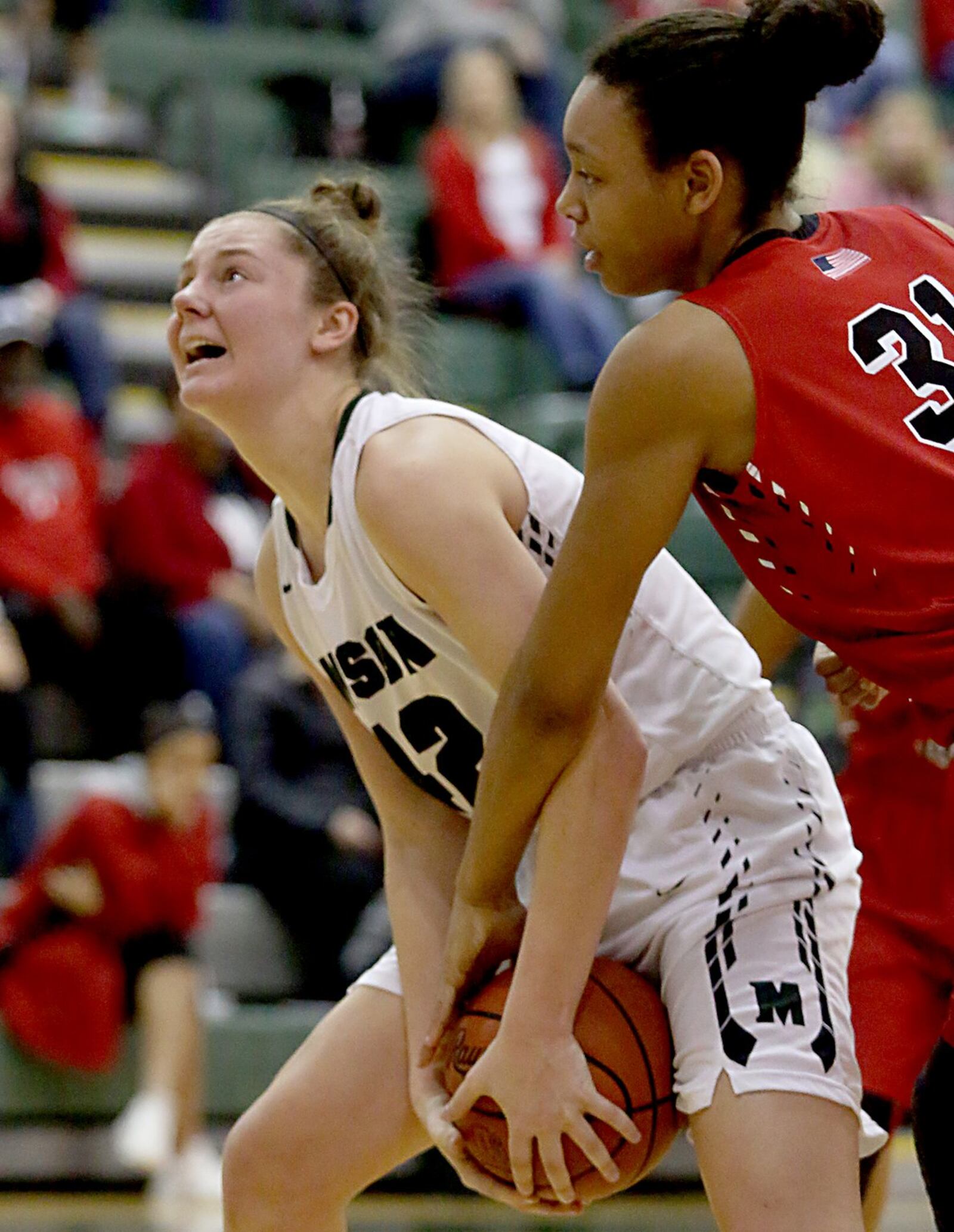 Mason’s Anna Brinkmann is fouled by Lakota West’s Nevaeh Dean during Saturday afternoon’s game at the Mason Arena. CONTRIBUTED PHOTO BY E.L. HUBBARD