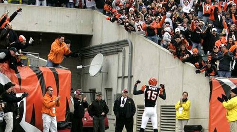 Chris Henry displays a look-at-me attitude after scoring a touchdown. The score came with 5:02 left in the third quarter. After the extra point, Arizona held a 28-20 lead. The Cardinals went on to defeat the Bengals 35-27.