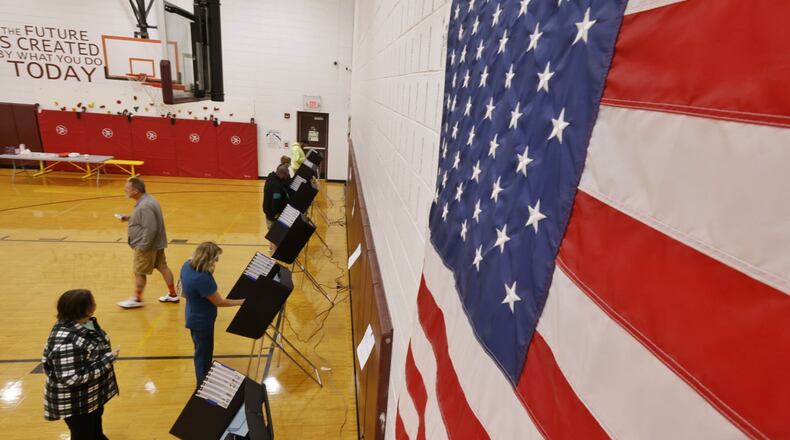 Thousands of area school families watched election results Tuesday evening and saw all two of three school tax hikes rejected locally. Ross and Talawanda school levies went down to defeat but Kings in southern Warren County saw voters approve that district’s first new operating levy since 2016. Pictured are voters at Elda Elementary in Ross Schools. (Photo By Nick Graham\Journal-News)