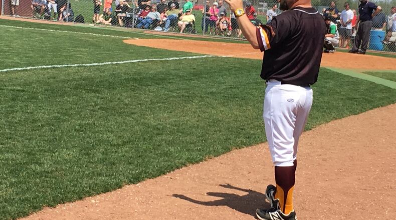 Ross coach Jason Rettinger works from the third-base coaching box during Sunday afternoon’s 5-4 victory over visiting Badin. RICK CASSANO/STAFF