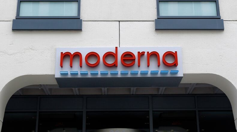 FILE - A sign marks an entrance to a Moderna building in Cambridge, Mass., May 18, 2020. (AP Photo/Bill Sikes, File)