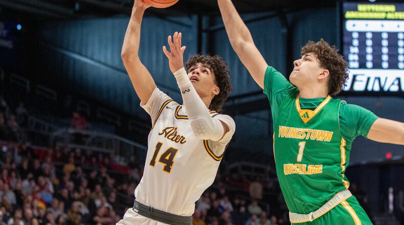 Alter's R.J. Greer scores against Youngstown Ursuline's Geno Lucente during the Knights' state semifinal win last year at UD Arena. Jeff Gilbert/CONTRIBUTED