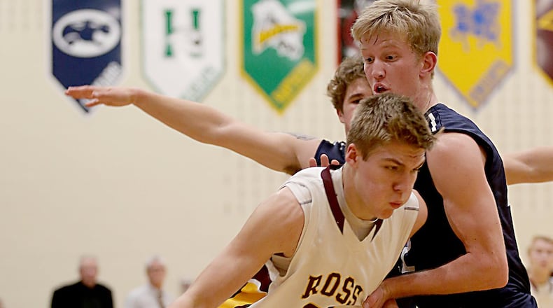 Landen Angel of Ross tries to get upcourt as Edgewood’s Drew Reckart (5) and Ethan McCarty apply pressure during their game at Ross on Dec. 23, 2016. COX MEDIA FILE PHOTO