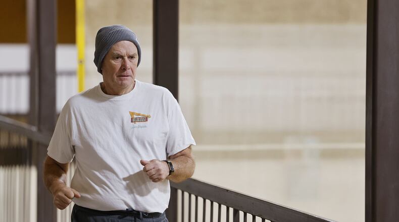 Jeff Jena had triple bypass surgery and now walks at Middletown YMCA every morning as part of his rehabilitation. NICK GRAHAM/STAFF