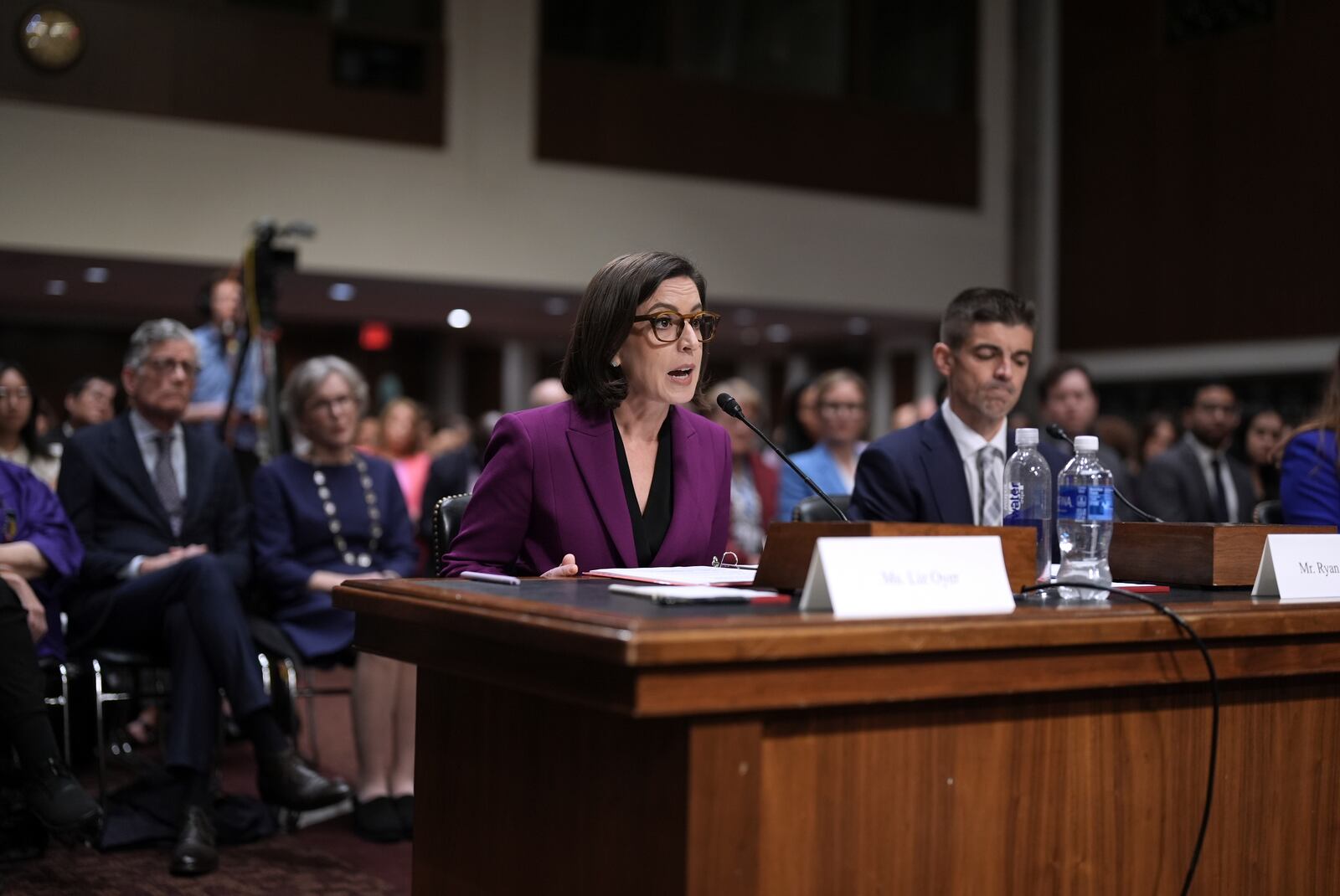 Former Justice Department attorneys Liz Oyer and Ryan Crosswell, testify before the House and Senate Judiciary Committee members during a hearing on the Justice Department under President Donald Trump, on Capitol Hill in Washington, Monday, April 7, 2025. (AP Photo/J. Scott Applewhite)