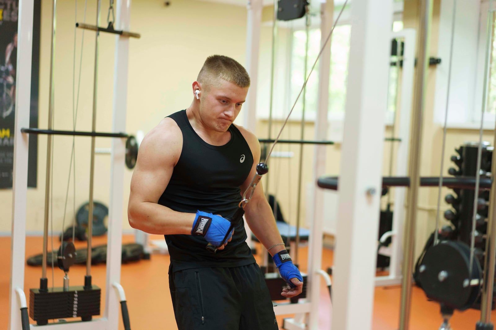 Ukrainian soldier Denys Zalizko, 21, works out in a gym at a rehabilitation center in Kyiv region, Ukraine, Wednesday, July 2, 2025. (AP Photo/Evgeniy Maloletka)